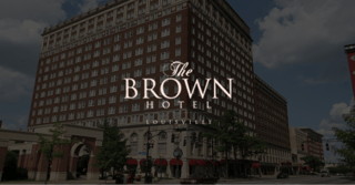 Exterior of The Brown Hotel with logo overlayed